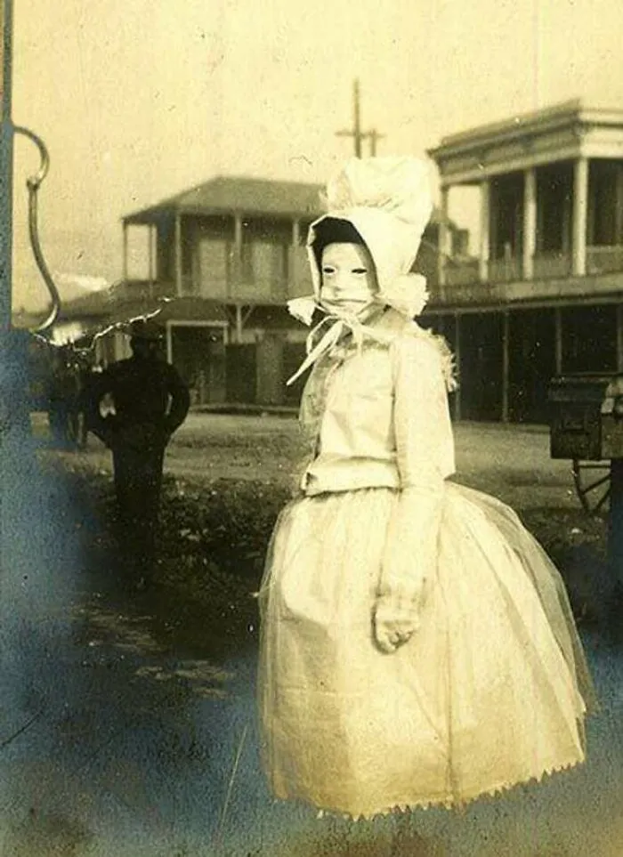 A Woman In The Wild West Wearing A Bonnet And A Mask Designed To Protect Skin From Sun Damage