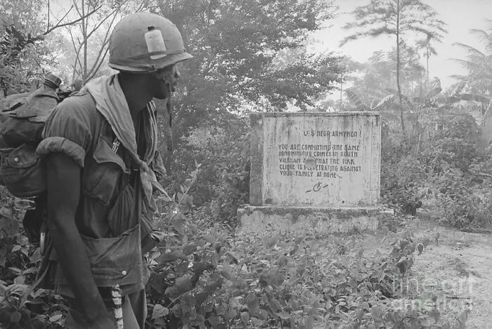 A Black U.S. Soldier Reads A Message Left By The Việt Cộng During The Vietnam War, The Message Reads: "U.S. Negro Armymen, You Are Committing The Same Ignominious Crimes In South Vietnam That The Kkk Clique Is Perpetrating Against Your Family At Home.", 1970.