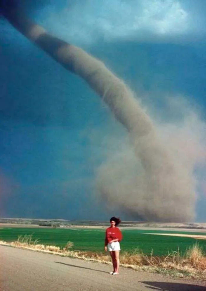 Girl Poses Next To A F1 Tornado A Mile Away