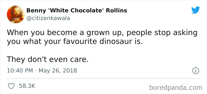 Tweet about adulthood humorously highlighting loss of interest in dinosaurs.