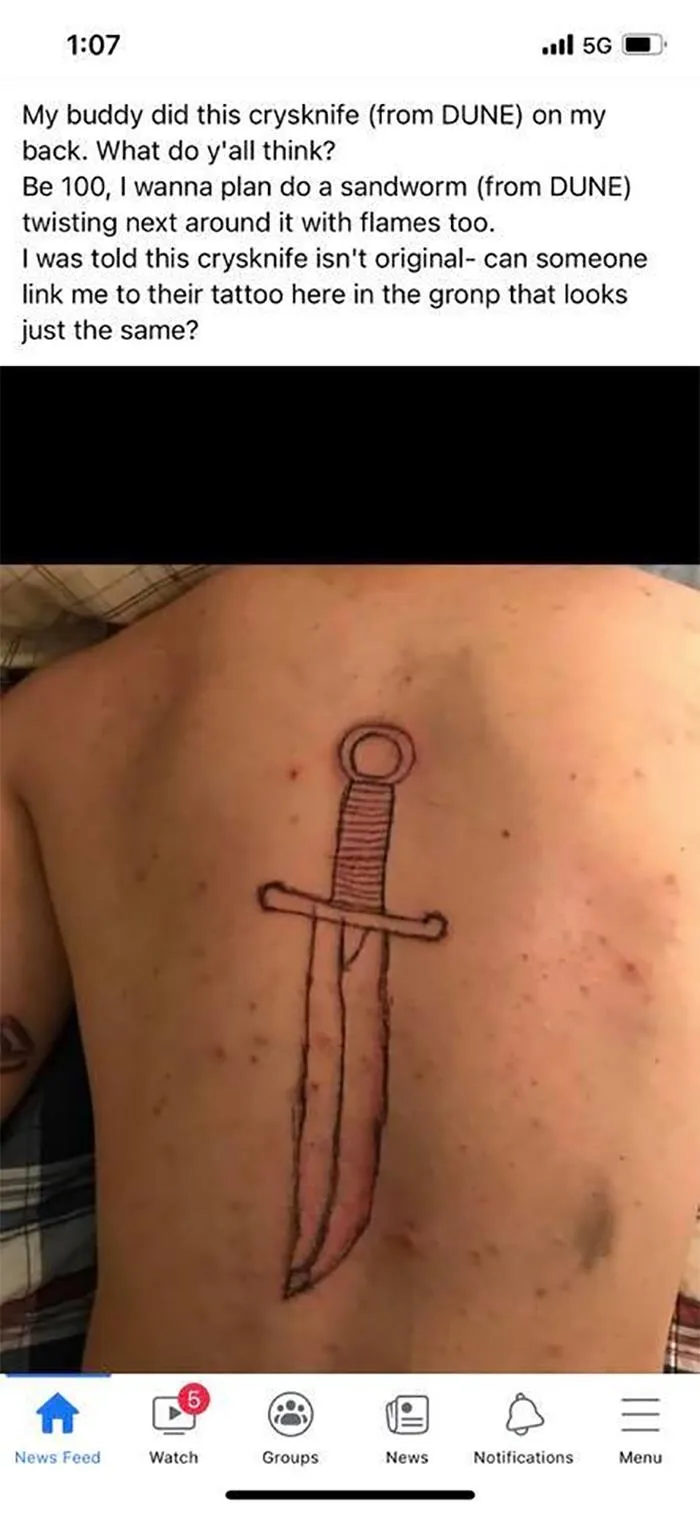 Unusual tattoo on a person's back, inspired by Dune, showcasing questionable inkwork.