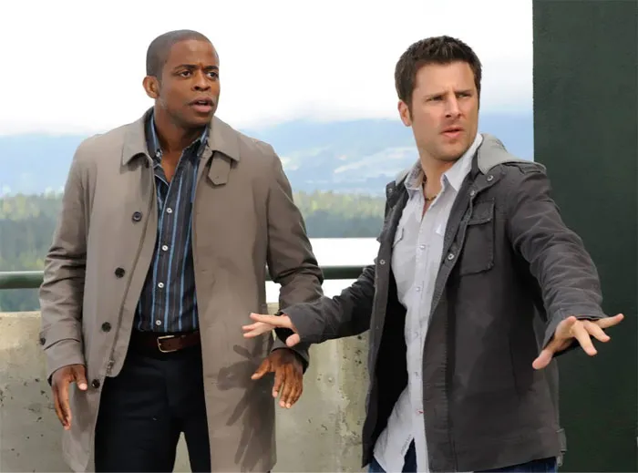 Shawn and Gus standing next to each other, looking confused