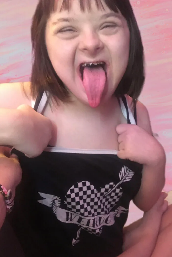 My Daughter Who Passed Away From Covid Last Month.  This Is Her “Weirdo” Shirt And Weirdo Face.