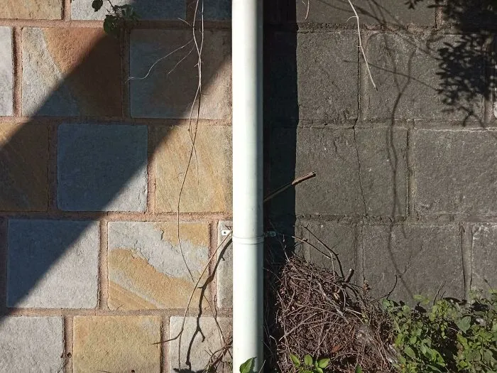 A Freshly Power Washed Wall vs. Decades Of Grime