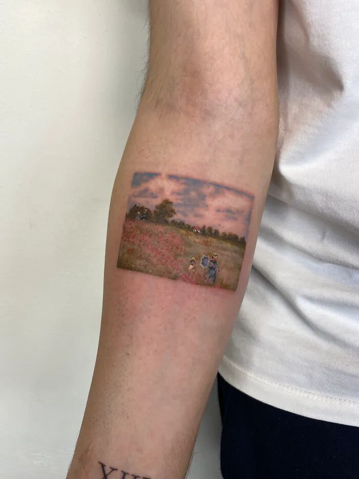Intricate first tattoo of a landscape scene on forearm, showcasing detailed artistry.