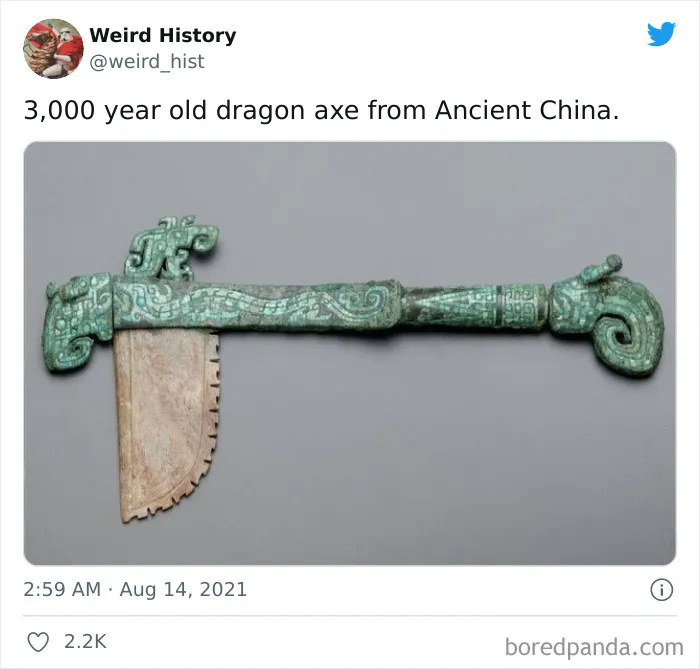 Ancient Chinese dragon axe over 3,000 years old with intricate carvings and unique historical design.