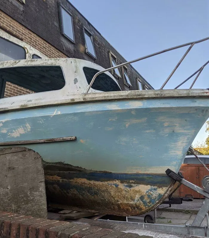 The Wear And Scuff-Marks On This Boat Look Like An Island In The Sea