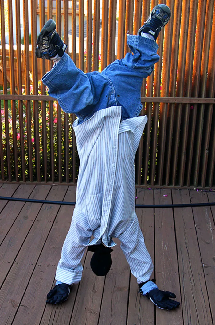 Creative Halloween costume idea using minimal effort with upside-down pose and casual clothes for simple Halloween costumes.