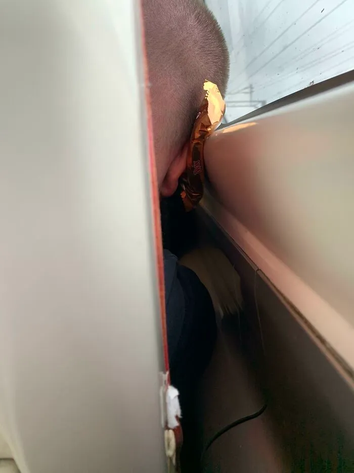 The Man Sitting In Front Of Me On The Train Is Using A Twix As A Pillow