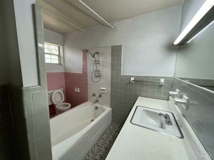 You Have To Step Over The Bathtub To Get Between The Toilet And The Sink
