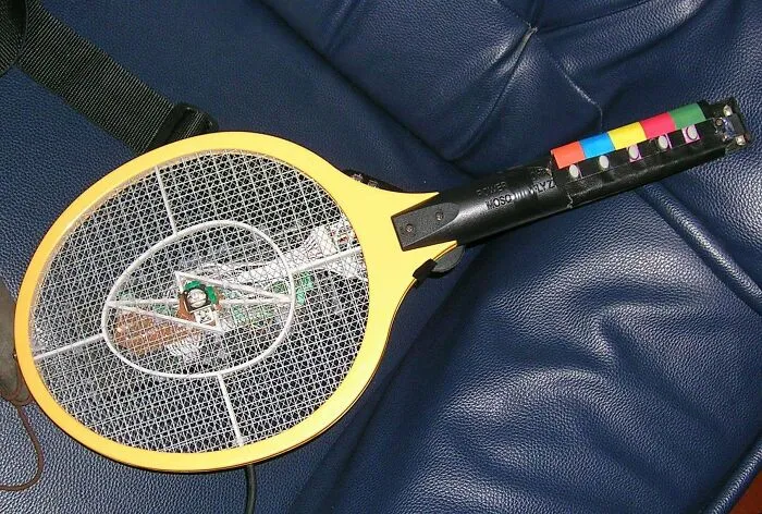 Back In 2006 When We Lived In Thailand I Couldn't Find A Guitar Hero Guitar For My Playstation 2 So I Hacked A Knock-Off Dualshock Controller And A Mosquito Zapper Into A DIY Guitar Hero Controller - Complete With A Mercury Switch For Star Power