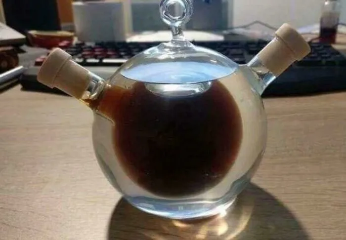 Bottle Of Rum Within A Bottle Of Vodka