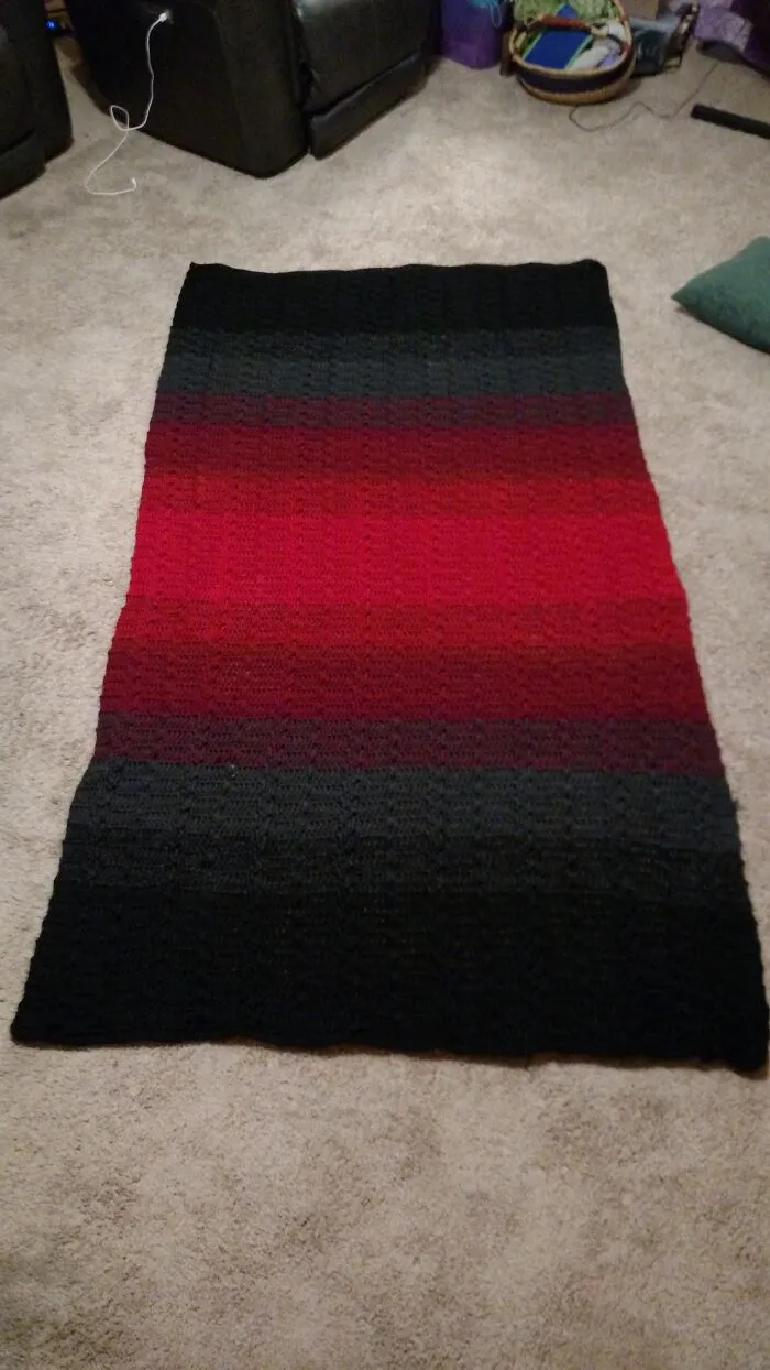 Crocheted Afghan Made As A Christmas Present For A Yarn-Worthy Loved One.  Used Two Strands Of Yarn To Be Able To Get The Ombre Effect.  There Are Bobbles And Cables.