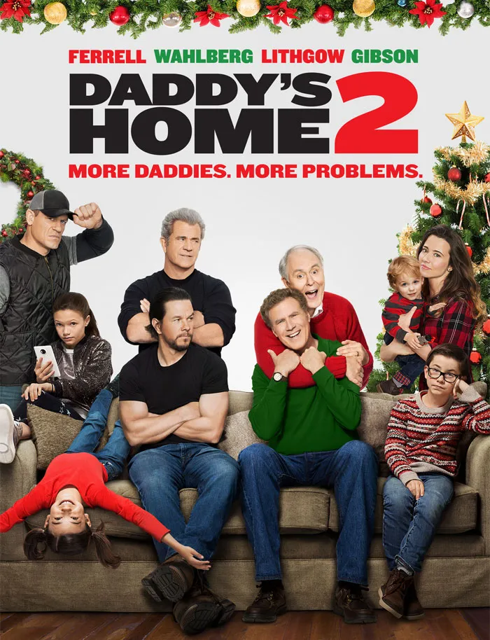 Christmas movie scene with a festive family gathered on a couch, decorated with garlands and Christmas tree.