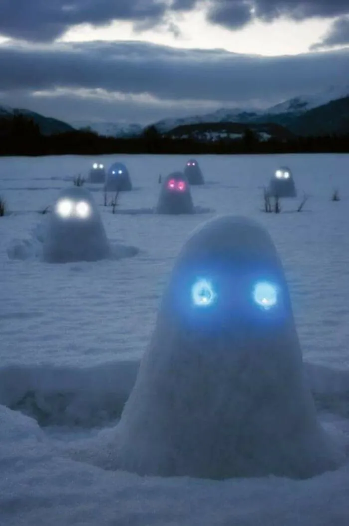 Snow Mounds With Glow Sticks In Them
