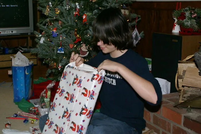 Opening Gifts In Front Of Family Members