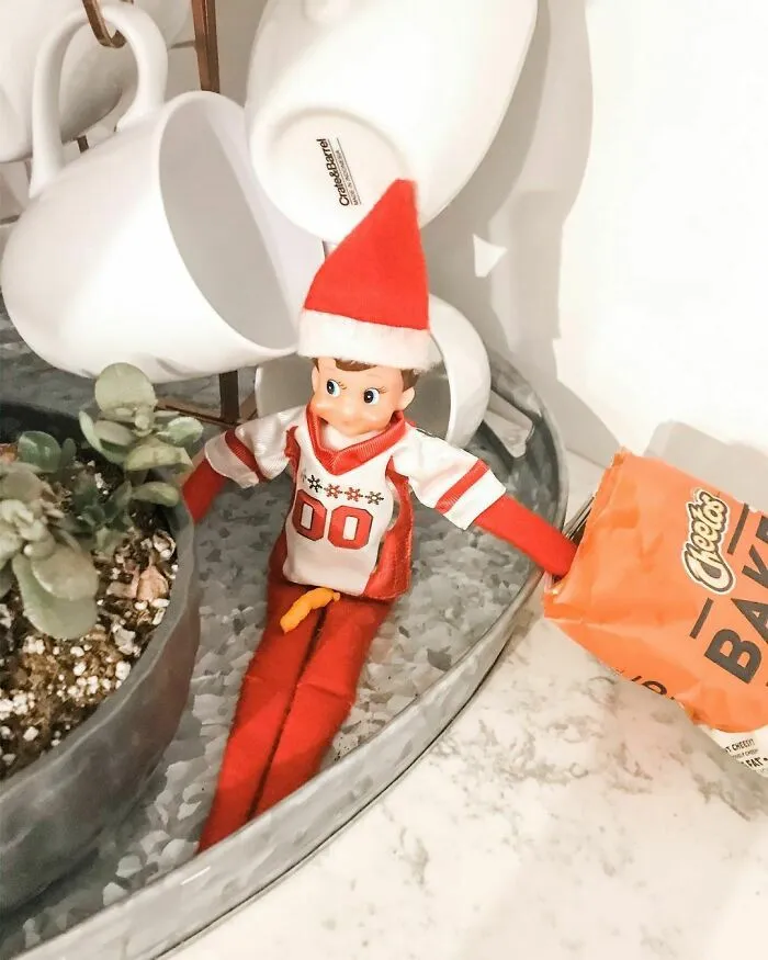  Set The Elf Up Eating Cheetos, And Didn't Notice Where I Sprinkled Them Until My Kids Started Laughing