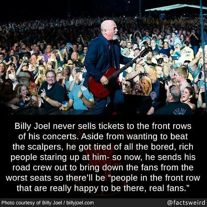 Billy Joel performing live with a large crowd, illustrating one of the weird facts about the world and concert experiences.