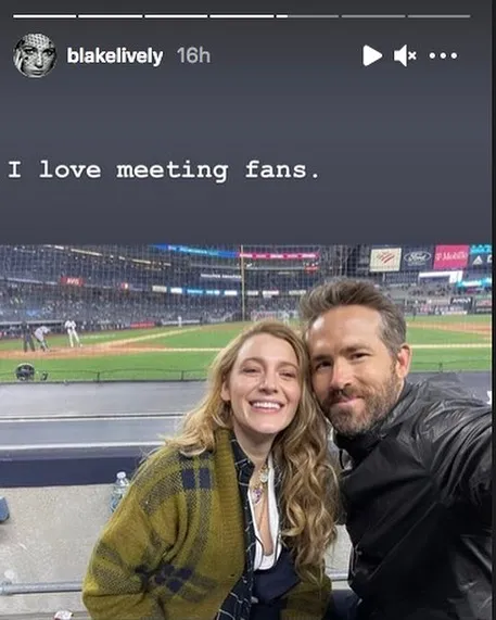 blake lively and ryan reynolds smiling at a baseball stadium with text about meeting fans in a funny memes context