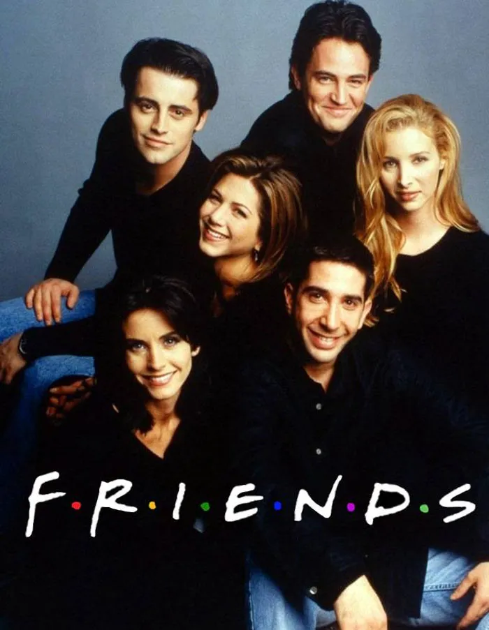 Cast of a popular TV show posing together, evoking nostalgia and humor.