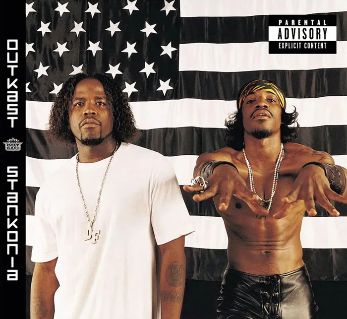 Greatest album covers: two men posing in front of a black and white American flag.