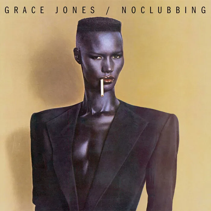 Bold album cover featuring a person with striking makeup and clothing, emphasizing unique design among greatest album covers.