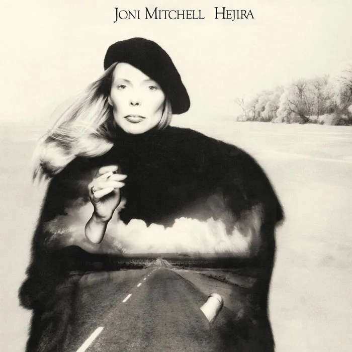 Album cover featuring a monochrome portrait with a road extending through the artist, exemplifying one of the greatest designs.