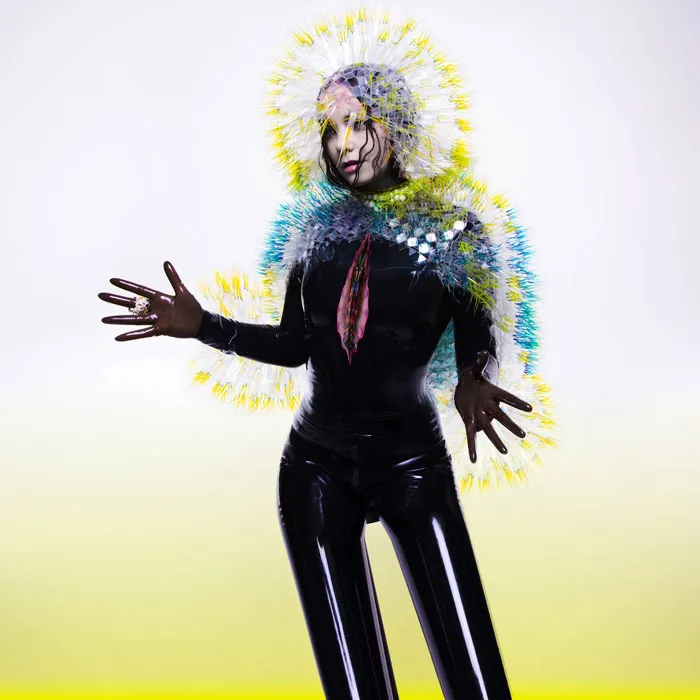 Unique and futuristic design of one of the greatest album covers featuring an artist in an avant-garde outfit.