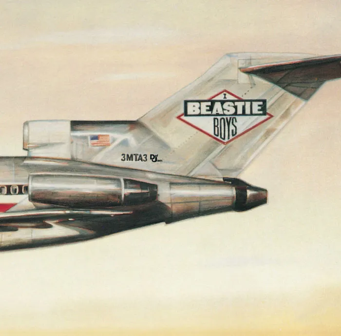 Airplane tail with Beastie Boys logo on iconic album cover.