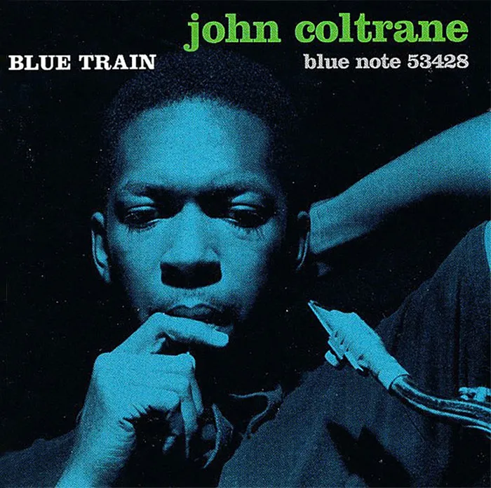 Iconic album cover featuring a contemplative musician with a saxophone, in blue tones.