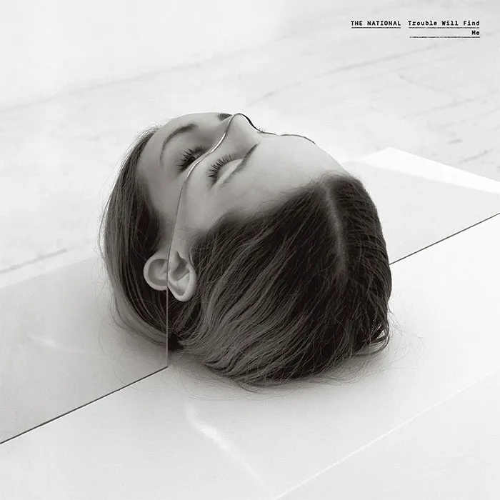 Surreal art on album cover featuring a woman's mirrored face; example of greatest album covers.