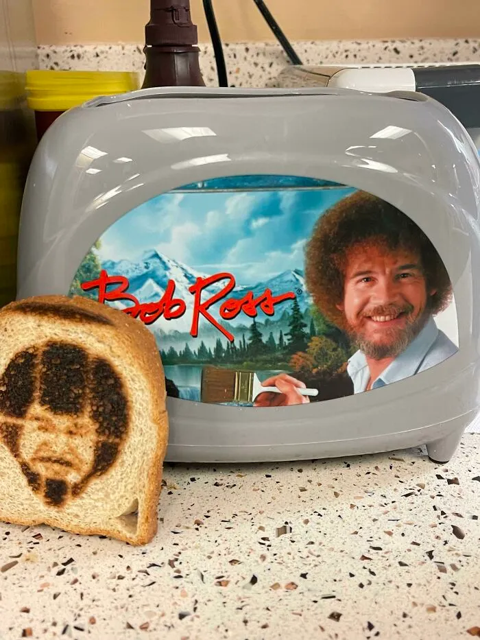 Someone Put A Bob Ross Toaster In Our Breakroom, And It Burns An Image Of Bob Ross Onto The Toast