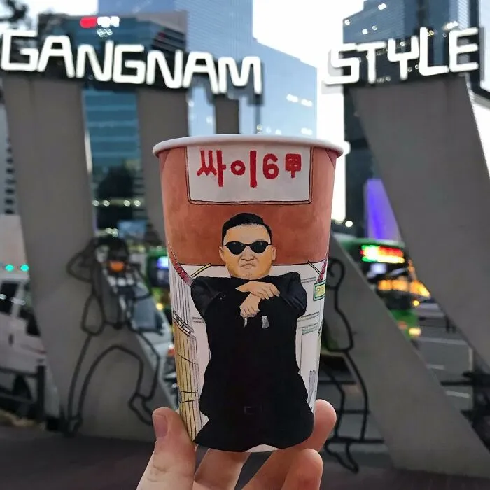 Paper cup illustration of a man in sunglasses with arms crossed, part of 40 illustrations drawn while traveling the world.