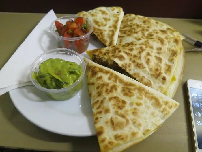 Cooking Quesadillas In A Buttered Skillet