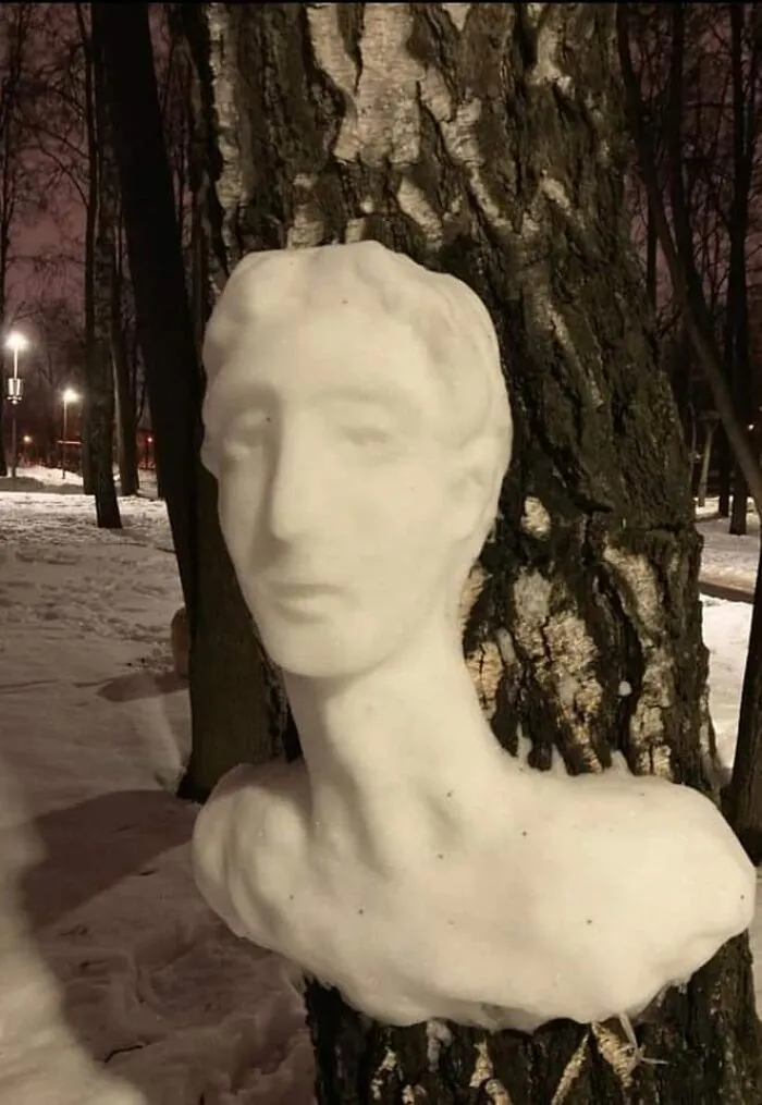20 Snow Sculptures On Tree Trunks Made By A Russian Chemist Who Just Wanted To Decorate Her Neighborhood