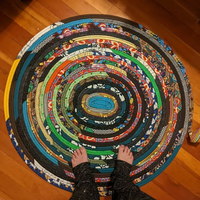 Wanted New Fabric, Wouldn't Get New Fabric Until I Used My Old Stuff. Wanted A Rug, Didn't Want To Pay For A Rug. Two Birds, One Stone! Work In Progress. Made From New Batting (Less Than $20) And Scrap Fabric (Some 20+ Years Old). Not The Prettiest Thing I've Made, But I Like It