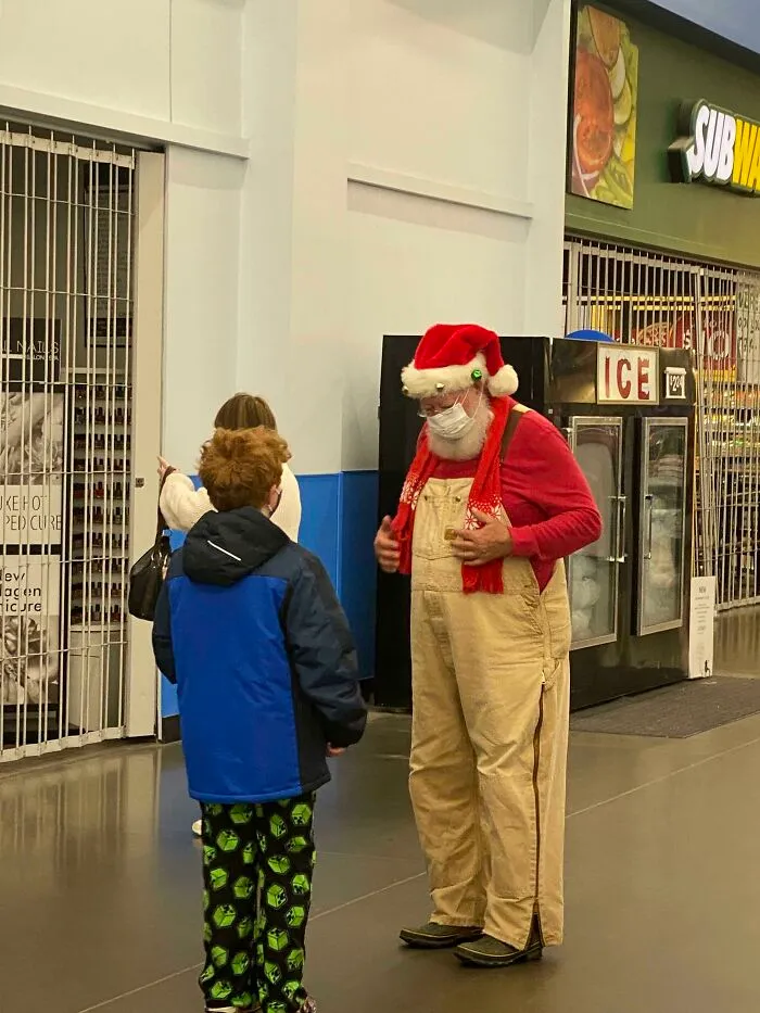Boy talking to a Santa in Walmart 