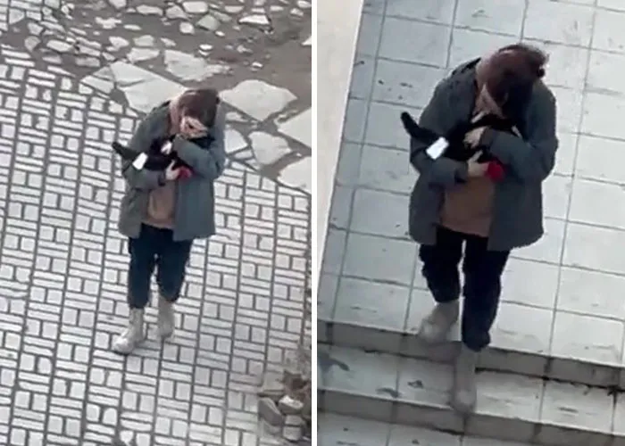 Woman Carries And Comforts Cat Amid Air Raid Sirens Sounding In Kyiv, Ukraine