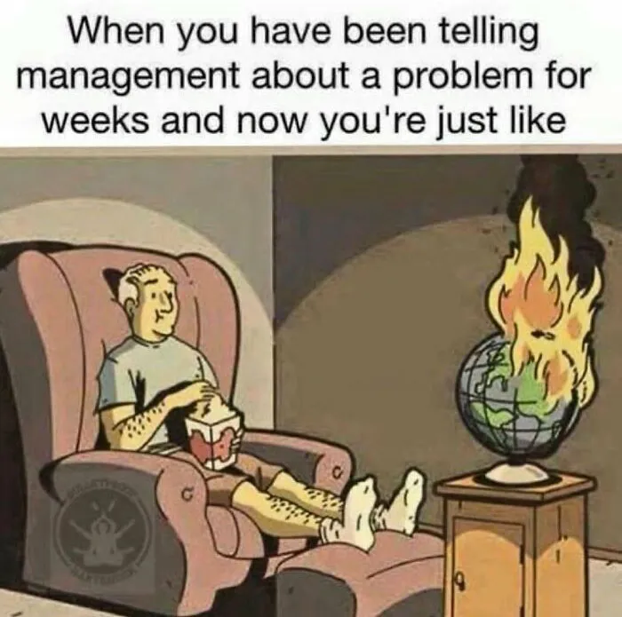 Man in chair calmly eating popcorn as globe burns beside him, illustrating corporate humor about office problems.