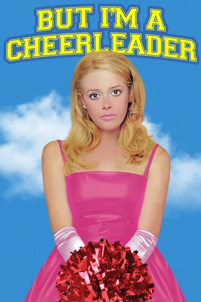 Young woman in pink dress and gloves holding red pom-poms against blue sky, representing dark comedy movies.