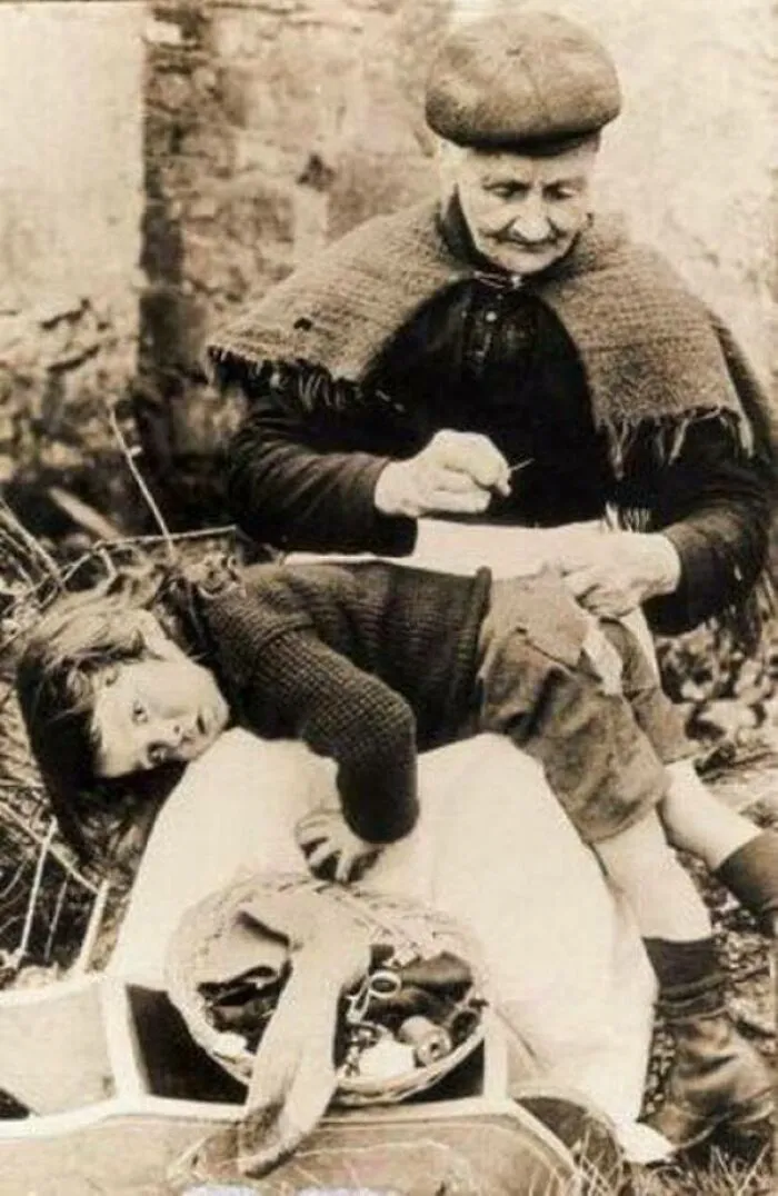 Grandma Patching The Only Pants Of Her Grandson, 1907