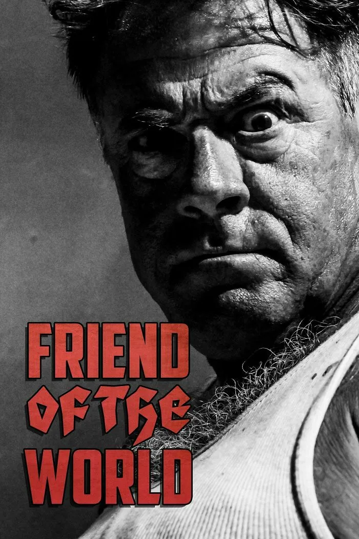 Close-up black and white photo of a man with an intense expression, representing horror comedies mood.