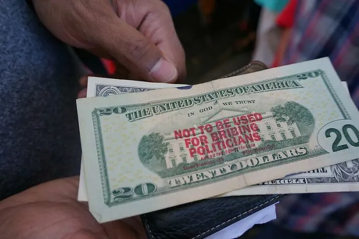 Do Not Try To Bribe An Officer Of The Law
