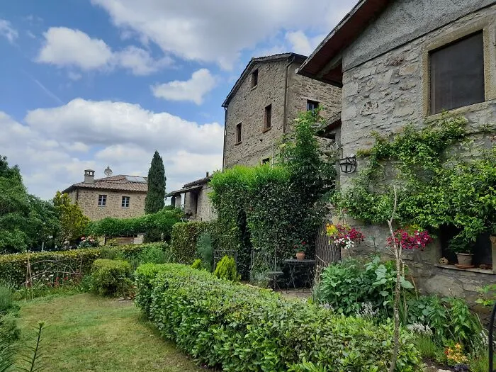 Italy. A Five House Hamlet On A Hill.