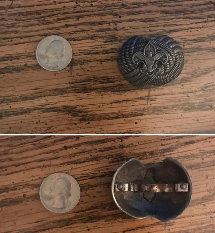 Witt: Small Metal Trinket Found Buried On Rural Missouri Farm. Appears To Have An Eagle, Flor De Lis, And Rope Pattern On From And A Metal Band On The Back. Quarter For Scale
