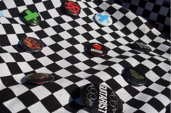 Different pins on a chess board like material 