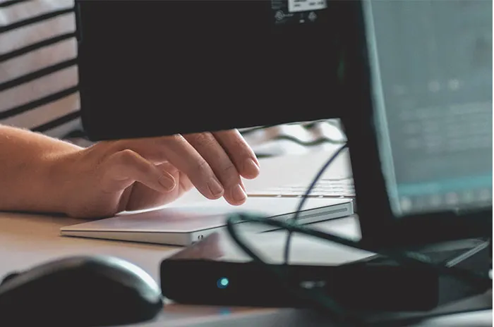 Person typing on keyboard 