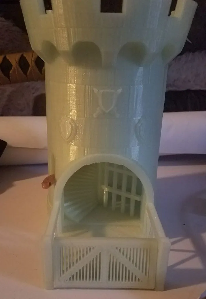 Cute snake peeking from a toy castle, showcasing its adorable features.