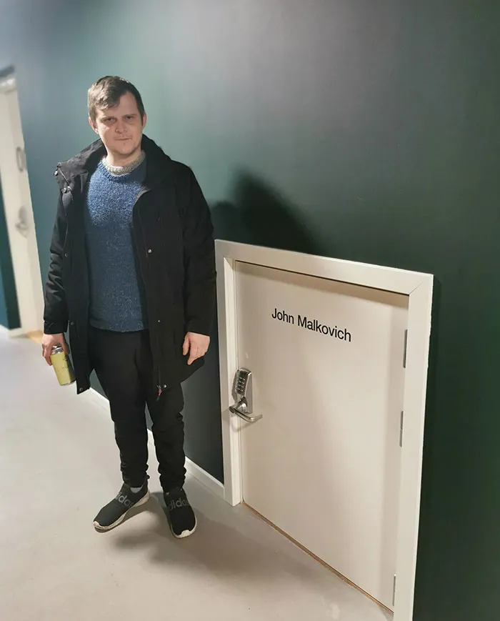 The Hotel I'm Staying At Has A Tiny Door That Says "John Malkovich"