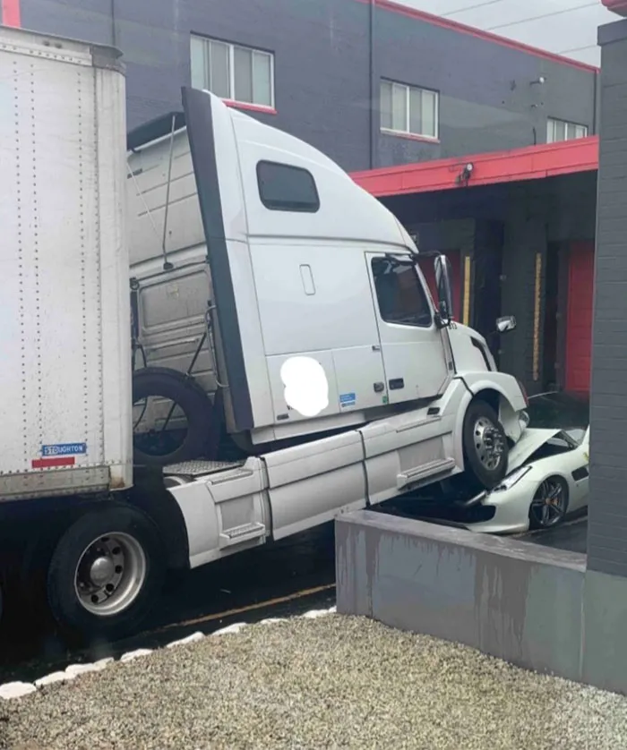 The Company Owner Decided To Stop Paying His Drivers So One Of Them Parked Their Semi On The Owner's Ferrari And Just Left It There